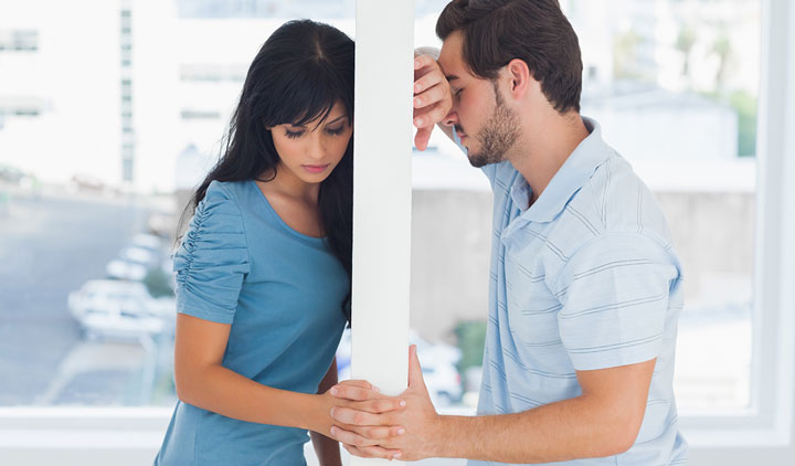 Broken up couple looking like they want to reconcile