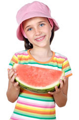 Young girl eating watermelon